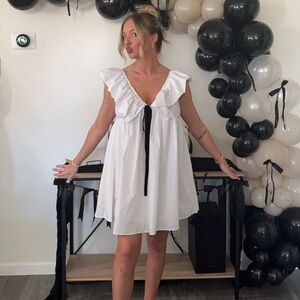 White Ruffle Dress with Black Bow